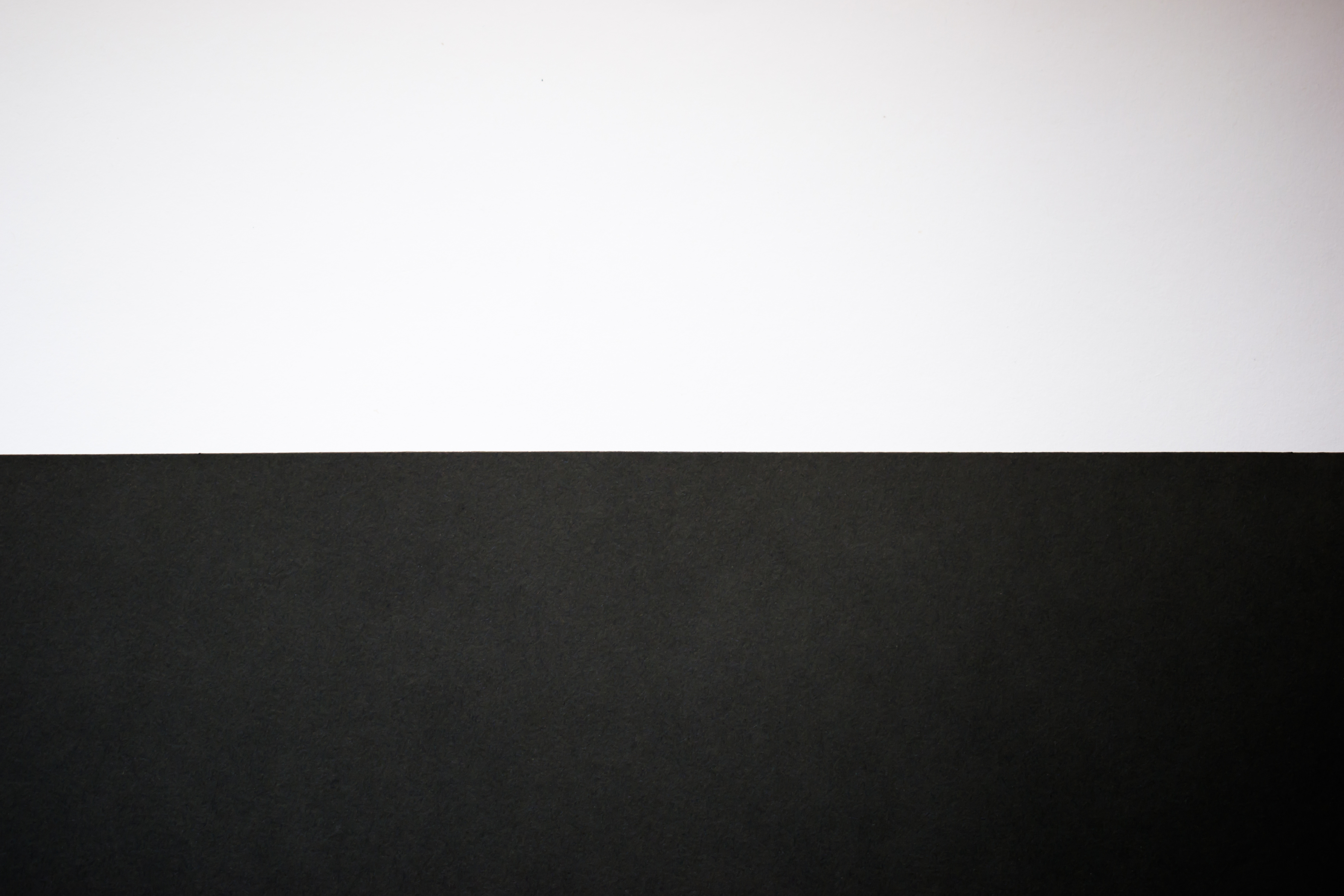 Abstract black and white background. Half black, half white background, wallpaper