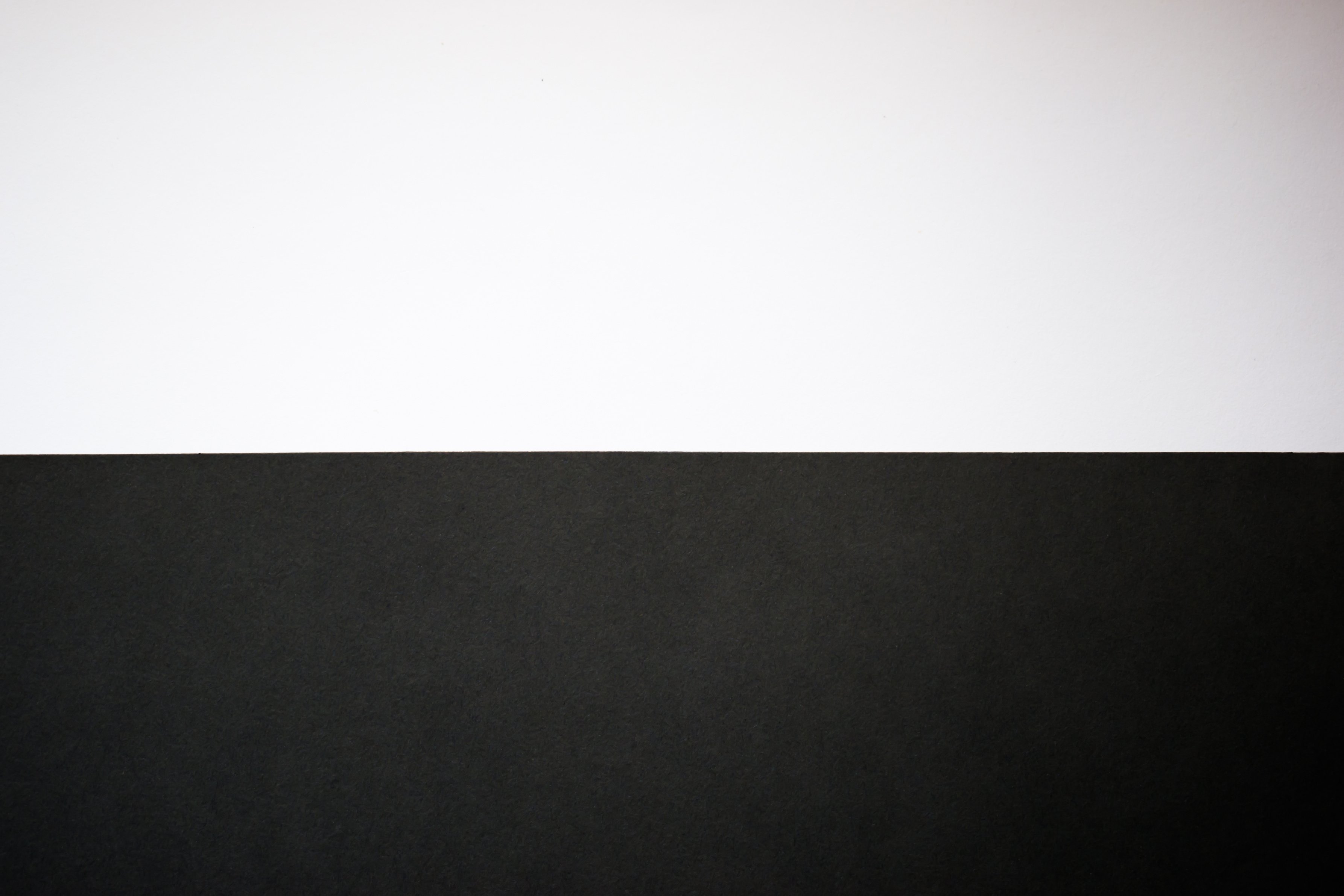 Abstract black and white background. Half black, half white background, wallpaper
